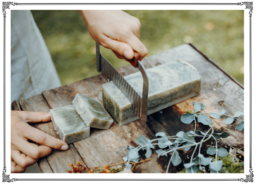 A person using a knife and fork to cut soap.